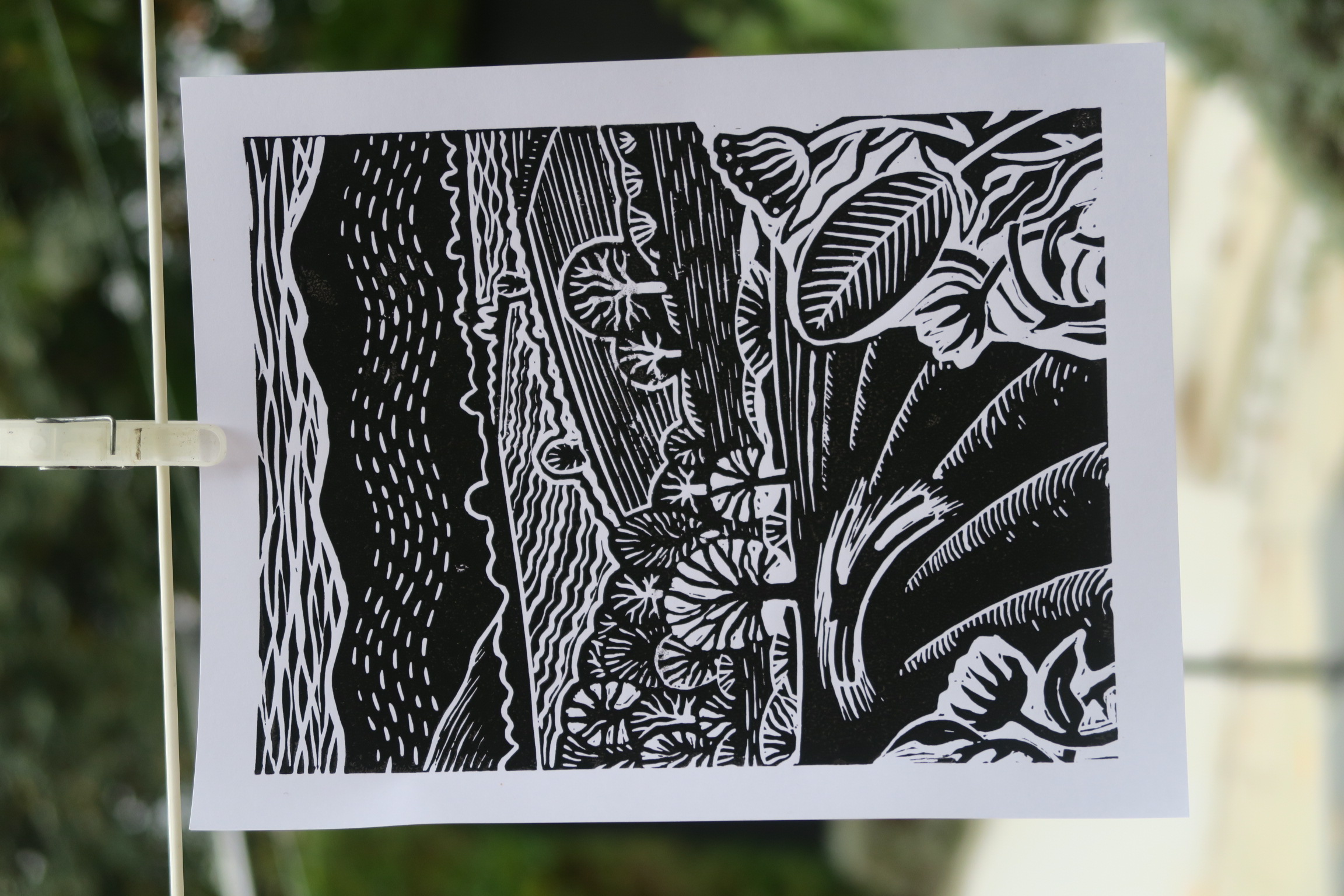 Linocut print of river plants